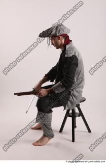 JACK PIRATE SITTING POSE WITH GUN AND DAGGER